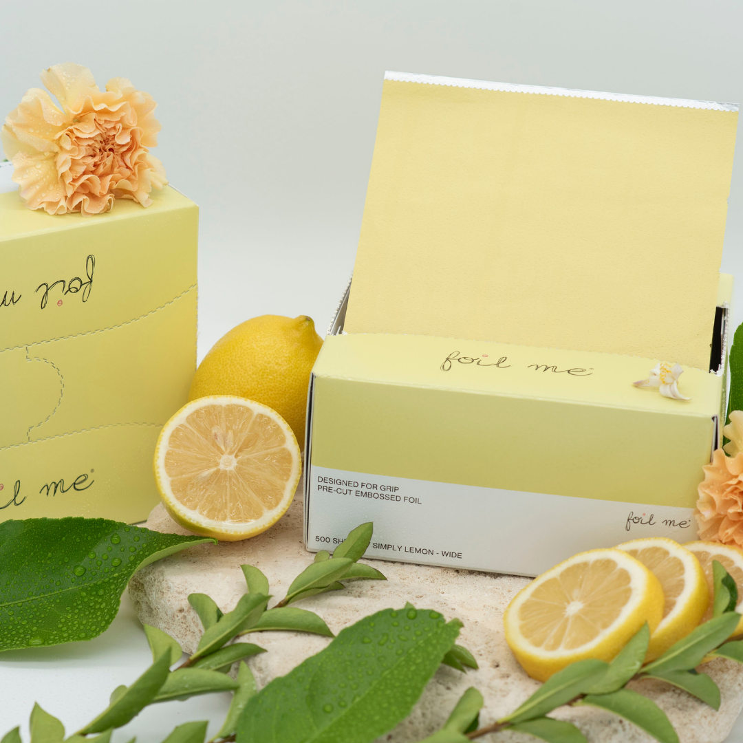 A box of pre-cut butter yellow hair foil sheets with a label that reads 'foil me', designed for use in hair color, balayage and high lights