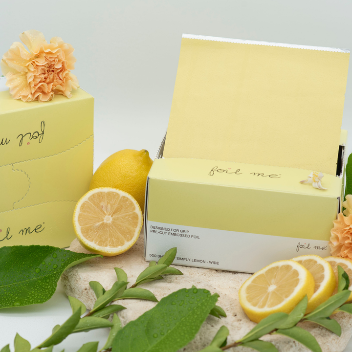 A box of pre-cut butter yellow hair foil sheets with a label that reads 'foil me', designed for use in hair color, balayage and high lights