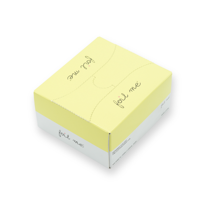A box of pre-cut butter yellow hair foil sheets with a label that reads 'foil me', designed for use in hair color, balayage and high lights